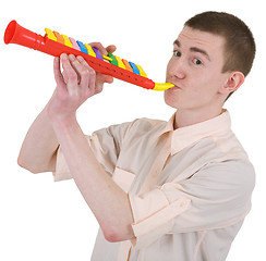 Image showing Young man and toy, trumpet