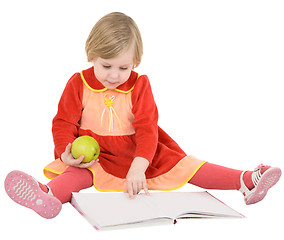 Image showing Little girl reads a book