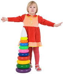 Image showing Little girl and toy pyramid