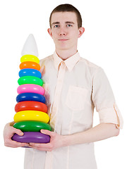 Image showing Young man and toy pyramid