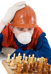 Image showing Labourer with chess 