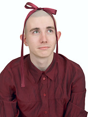 Image showing Young man with small bow on head