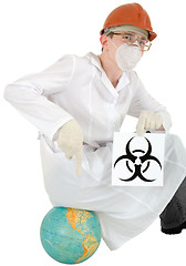 Image showing Scientist with poster biohazard sit on a globe