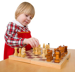 Image showing Little girl and chess