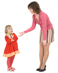 Image showing Woman asks apple beside little girl