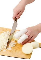 Image showing Hands, cutting onions