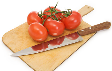 Image showing Knife and branch tomatoes