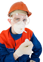 Image showing Man in respirator smoking