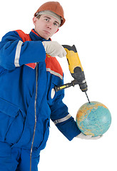 Image showing Laborer with hand drill and globe 