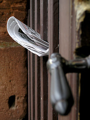 Image showing Newspaper and old door handle