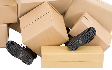 Image showing Male feet and heap of boxes