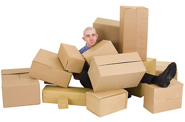 Image showing The man is heap up by boxes