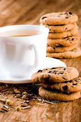 Image showing cup of herbal tea and some fresh cookies