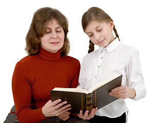 Image showing Woman and girl reading book