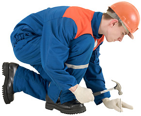 Image showing Man with hammer and nail