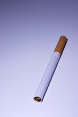 Image showing Isolated Cigarette Under Blue Light