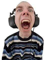 Image showing The person in ear-phones shouting