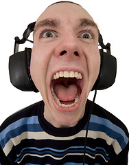 Image showing Person in ear-phones shouting