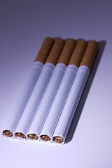 Image showing Isolated Cigarettes Under Blue Light