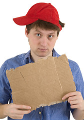 Image showing Man in red baseball cap and  tablet