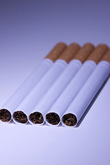 Image showing Isolated Cigarettes Under Blue Light