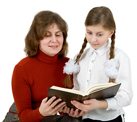 Image showing Woman and girl reading book