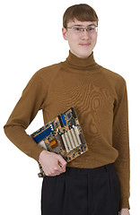 Image showing Young man holding motherboard