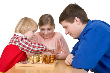 Image showing Man and child play chess