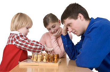 Image showing Man and child play chess