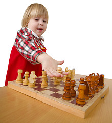 Image showing Small girl play chess