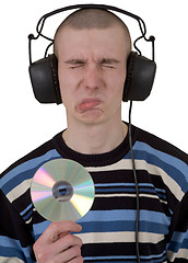 Image showing Man in phones and compact disk