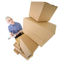 Image showing Man and pile cardboard boxes