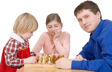 Image showing Man and childs play to chess