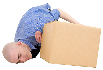 Image showing Man looking under cardboard box