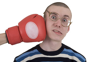 Image showing The man in spectacles taking punch 