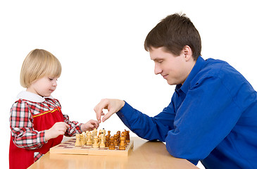 Image showing Man and girl play chess