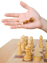 Image showing Hand and chess-man