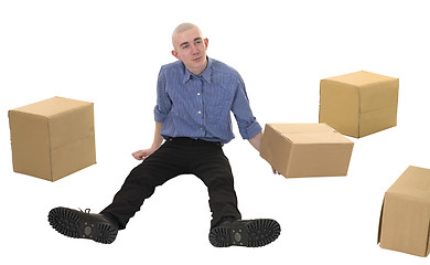 Image showing Man and pile cardboard