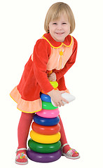 Image showing Child in the red dress with toy 