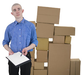 Image showing Man and pile cardboard boxes