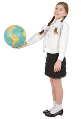Image showing Girl and terrestrial globe on white