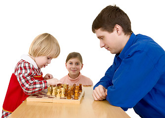 Image showing Man and childs play chess