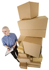 Image showing Man and pile cardboard boxes