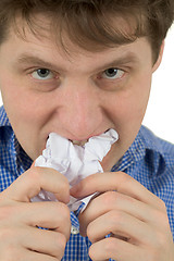 Image showing The man a chewing sheet of paper