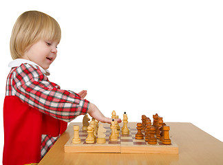 Image showing Little girl play chess