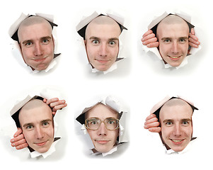 Image showing Six faces looking through holes