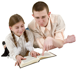 Image showing Young man and girl reading book