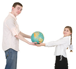 Image showing Girl and man hold terrestrial globe