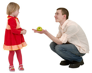 Image showing Young man, apple and little girl