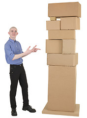 Image showing Man showing on pile cardboard boxes